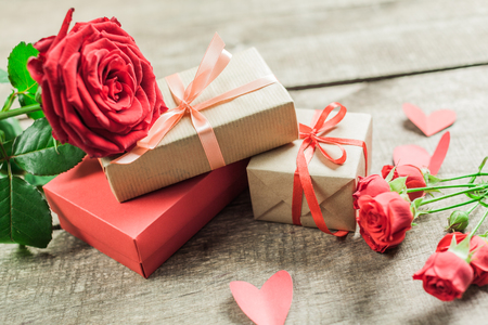 Roses and a hearts on wooden board, Valentines Day backgroundの写真素材