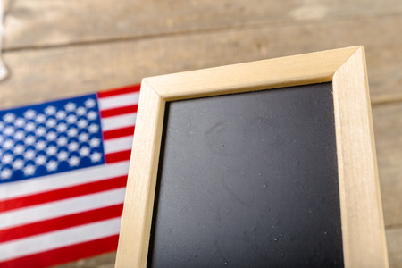 Blank chalk board with American Flagの写真素材