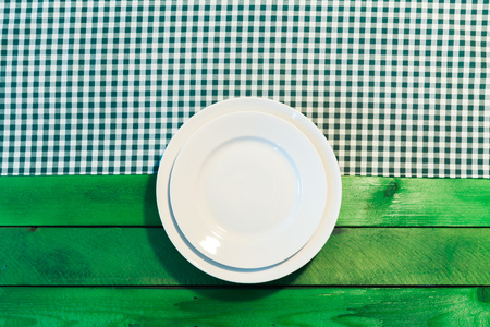 the plate on checkered table clothの写真素材