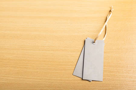 Blank tag on wooden backgroundの写真素材