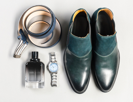 shoes and accessories for men lay on the wooden floorの写真素材