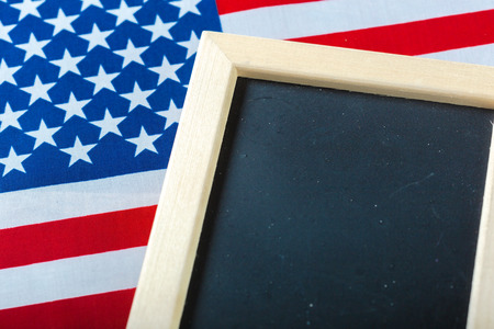 Blank chalk board with American Flagの写真素材