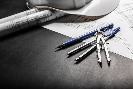 Construction planning drawings on black background