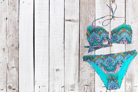 swimsuit on wooden background. top viewの写真素材