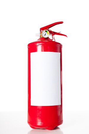 Red fire extinguisher isolated on whiteの写真素材