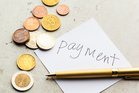 Money jar with coinsの写真素材