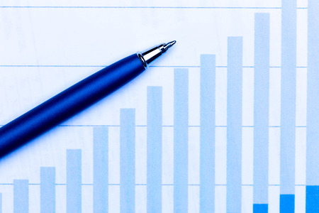 Business charts and penの写真素材