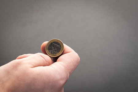 Tossing Euro coin, heads or tails you decideの写真素材