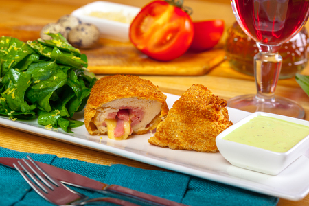 Breaded cutlet served on a plateの写真素材