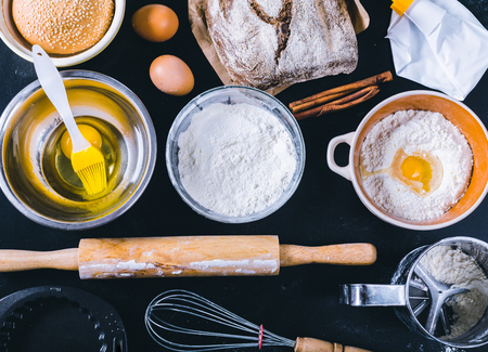 Ingredients and utensil for baking on the black board, top viewの写真素材