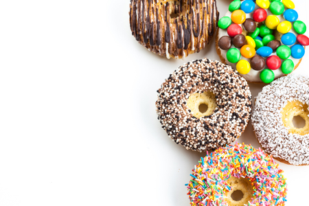 Delicious donuts with icing isolated on whiteの写真素材