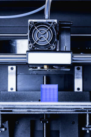head of 3d printer in actionの写真素材