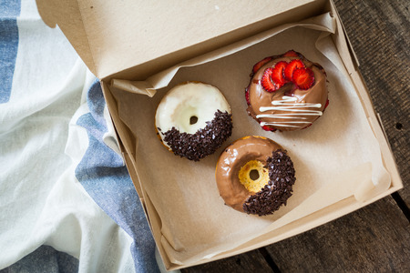 Colorful donuts in box
