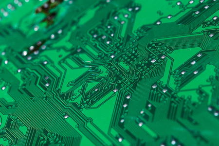 Close up of a printed green computer circuit boardの写真素材