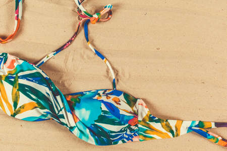 Holiday accessories on sand beachの写真素材