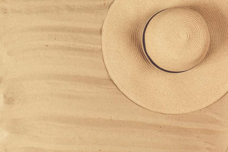Summer hat put on the tropical sand beachの写真素材