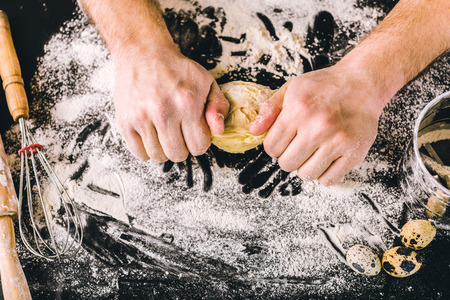 Hands kneading a dough