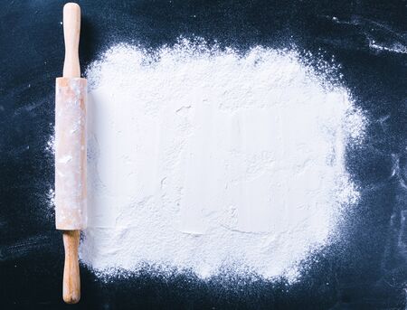 Baking desk with flour and rolling pin, top viewの写真素材