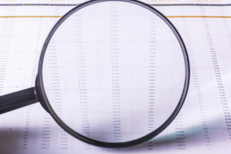 Magnifying glass and business growth graphの写真素材