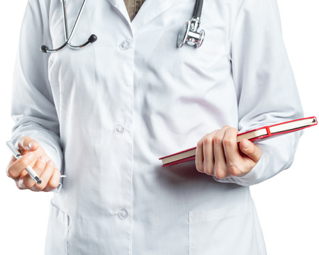 Woman doctor with a stethoscope. Isolated on white.の写真素材