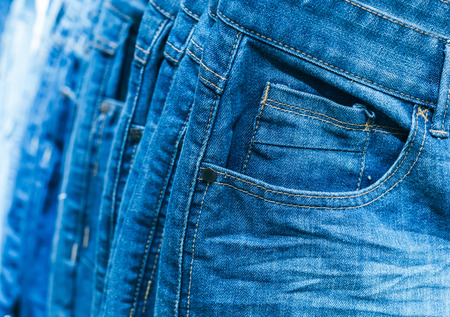 Different clothes on hangers close upの写真素材