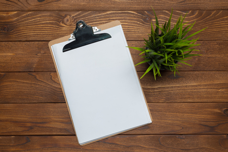 white paper clipboard on wood backgroundの写真素材