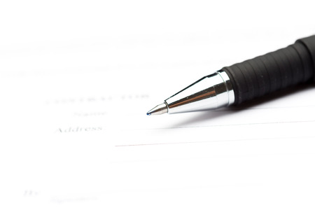 Close-up of pen on contractの写真素材