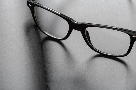 Blank black diary with eyeglassesの写真素材