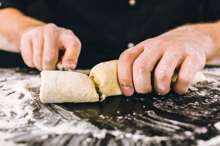 Hands kneading a doughの写真素材
