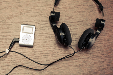 headphones on wooden backgroundの写真素材