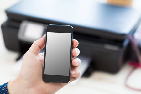 Unrecognizable man using mobile phoneの写真素材