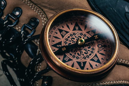 compass with hiking-boots