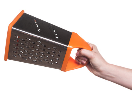 kitchen utensils in the hand of women isolated on white backgroundの写真素材