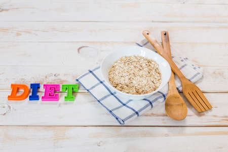 Bowl of porridge on wooden tableの写真素材