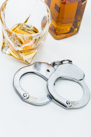 Car key on the bar with spilled alcoholの写真素材