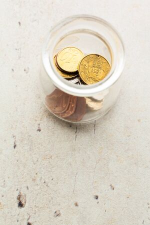 Money jar with coins
