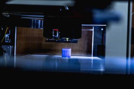 head of 3d printer in actionの写真素材