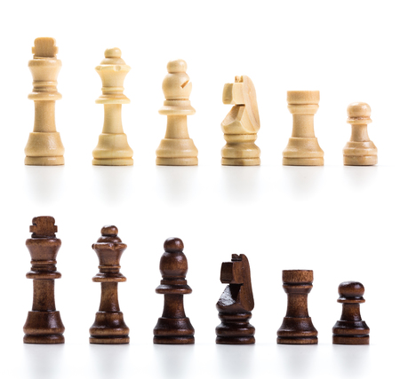 wooden chess set  lined up in rows isolatedの写真素材