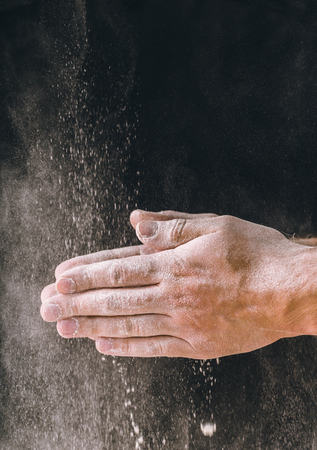 adult man hands work with flour, dark photoの写真素材
