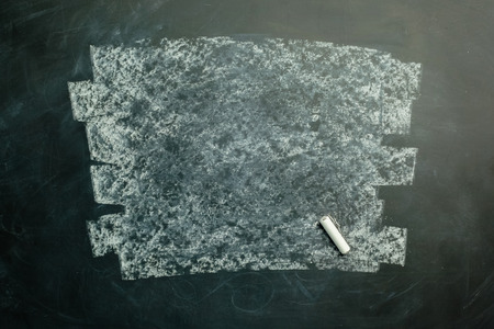 empty blackboard wooden framed soiled with dust of chalk rubbedの写真素材