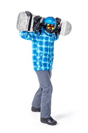 Portrait of young man in sportswear with snowboard isolated on a white background.の写真素材