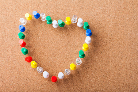 Group of Colored Pins arranged as Heart Shapeの写真素材