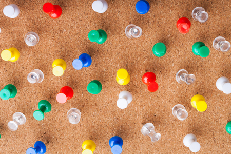 Group of thumbtacks pinned on corkboardの写真素材