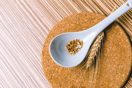 wheat on the wooden backgroundの写真素材