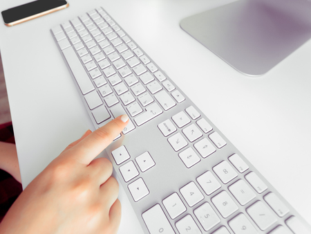 Hand of a woman typingの写真素材