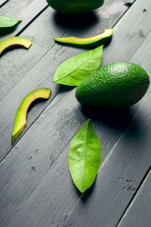 avocado on a wooden backgroundの写真素材