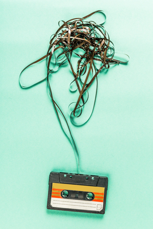 Old audio cassettes on turquoise backgroundの写真素材