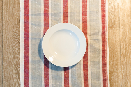 White Plate on a Tableclothの写真素材