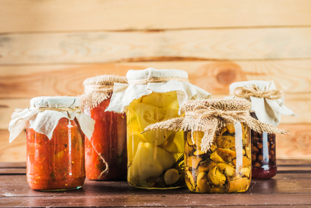 Preserved vegetables on wooden backgroundの写真素材