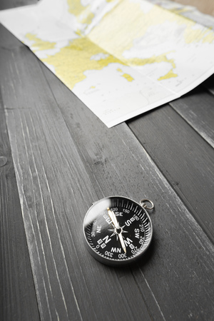 compass on the wooden table backgroundの写真素材